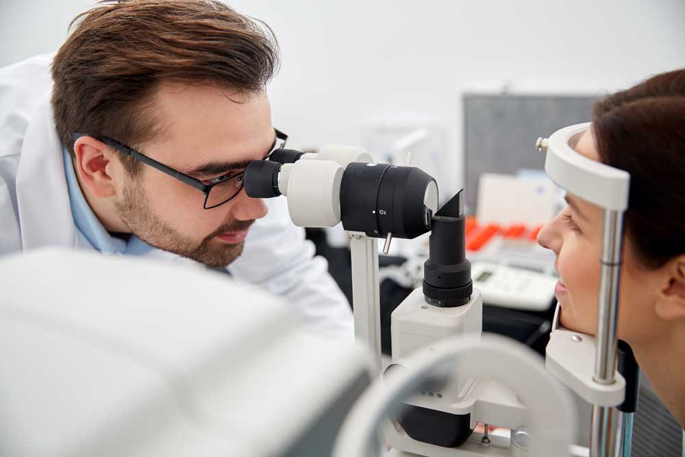 optometrist doing an eye exam